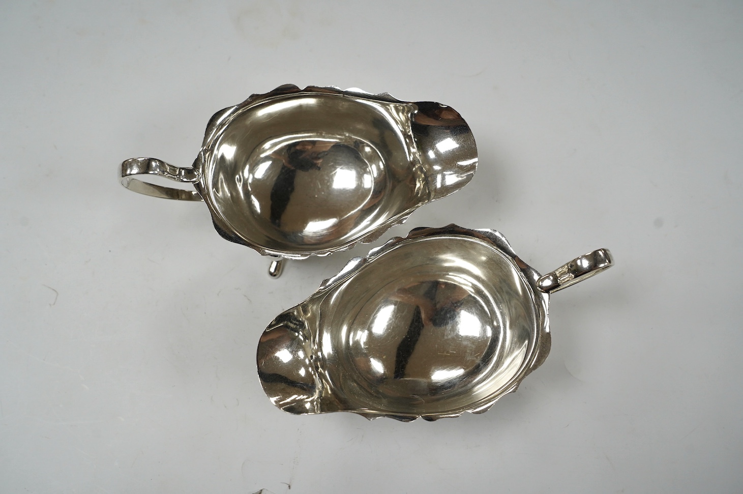 A pair of George V silver sauce boats, Elkington & Co, Birmingham, 1931, 15.6cm, 6.8oz. Condition - fair